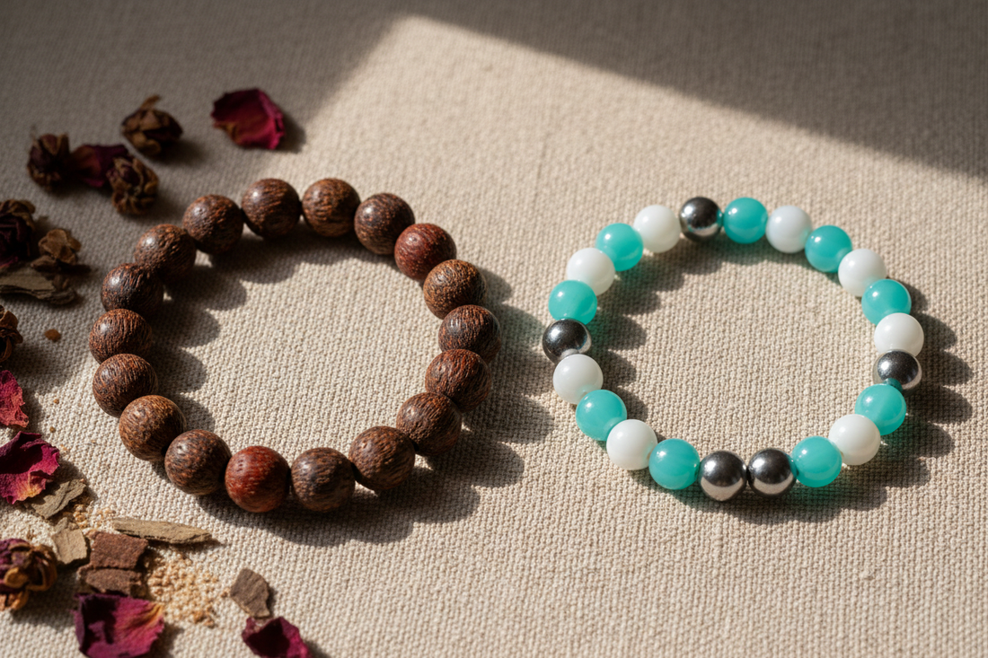 Flat lay comparison of a natural herbal incense bead bracelet made from sandalwood and agarwood beside a synthetic scented bracelet, surrounded by dried botanicals on linen